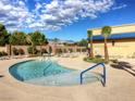 Community pool with lounge chairs and palm trees at 4290 S Gressa St, Pahrump, NV 89061