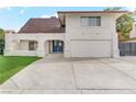 Two-story house with a double door entry and attached garage at 4330 Flandes St, Las Vegas, NV 89121