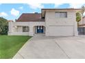 Two-story house with a double door entry and attached garage at 4330 Flandes St, Las Vegas, NV 89121