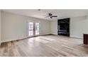 Spacious living room with fireplace and hardwood floors at 5129 Del Monte Ave, Las Vegas, NV 89146