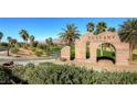 Tuscan-style golf club entrance sign with palm trees at 685 Viale Machiavelli Ln, Henderson, NV 89011