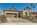 One-story house with a gray garage door and paved driveway at 685 Viale Machiavelli Ln, Henderson, NV 89011