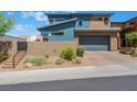 Modern two-story house with attached garage and desert landscaping at 7230 Galaxy Dune St, Las Vegas, NV 89148