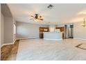 Open concept living room and kitchen with tile floors at 8658 Tom Noon Ave # 103, Las Vegas, NV 89178