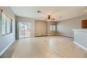 Spacious living room with tile floors and sliding glass door at 8658 Tom Noon Ave # 103, Las Vegas, NV 89178