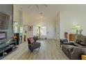 Bright living room featuring hardwood floors and comfy seating at 9900 Rosamond Dr, Las Vegas, NV 89134