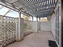 Covered patio area with brick wall and lattice fencing at 1008 Willow Tree Dr # B, Las Vegas, NV 89128