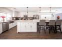 Modern kitchen with white cabinets and large island at 1015 Aspen Breeze Ave, Las Vegas, NV 89123