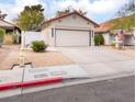 Charming single-story home with well-maintained front yard, fountain, and concrete driveway at 109 Ayesha Ln, Henderson, NV 89074