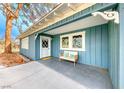 Quaint front porch with bench, offering a relaxing space at 1620 Leonard Ln, Las Vegas, NV 89108