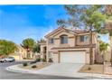 Two story house with tan exterior, brown roof, and a two car garage at 2153 Eaglecloud Dr, Henderson, NV 89074