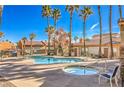 Relaxing community pool and spa with palm trees at 225 Big Horn Dr # 5, Boulder City, NV 89005