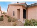 Exterior view of the home's entrance with landscaping and a security door at 312 Crosswind Way, Las Vegas, NV 89145