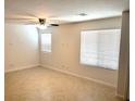 Bright living room with tile floors and ceiling fan at 3513 Golden Chariot Ave, Las Vegas, NV 89106