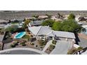 One-story house with pool and desert landscaping, aerial view at 3540 E Burgundy Dr, Pahrump, NV 89048