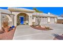 Inviting front entrance with a blue door and stone accents at 3540 E Burgundy Dr, Pahrump, NV 89048