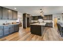 Modern kitchen featuring granite countertops and dark stained wood cabinets at 390 Peaceful St, Las Vegas, NV 89110