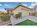 Single-story home with attached garage and well-maintained landscaping at 6075 Jutland Ave, Las Vegas, NV 89122