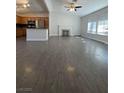 Spacious living room with a fireplace and wood-look flooring at 6552 Boxwood Ln, Las Vegas, NV 89103