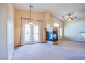 Bright living room with a fireplace and large windows, creating a warm atmosphere at 6752 Lookout Lodge Ln # 1, North Las Vegas, NV 89084