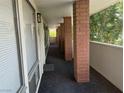 Interior hallway with brick columns and carpet at 730 Oakmont Ave # 904, Las Vegas, NV 89109