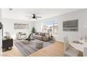 Open concept living room and dining area with hardwood floors at 1008 Wyatt Ave, Las Vegas, NV 89106