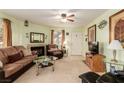 Living room with fireplace, TV, and comfortable seating at 1575 W Warm Springs Rd # 1113, Henderson, NV 89014