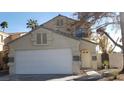 Two-story house with attached garage and landscaping at 346 Pinnacle Ct, Henderson, NV 89014