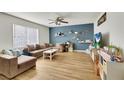 Spacious living room with sleek flooring, large window, and comfortable seating at 3473 Monte Carlo Dr, Las Vegas, NV 89121