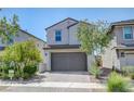 Attractive home showcasing a 2-car garage and well-maintained landscaping at 365 Andy Wheeler Dr, Henderson, NV 89011
