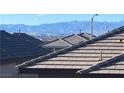 View of neighboring rooftops, with the city skyline and mountain range in the distance at 365 Andy Wheeler Dr, Henderson, NV 89011