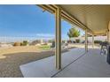 Covered patio featuring a seating area, barbecue, gravel and views at 412 Lost Trail Dr, Henderson, NV 89014