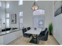 Dining area with marble-top table and modern chairs at 5859 Noble Stand St, Las Vegas, NV 89148
