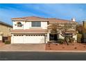 Charming two-story home featuring a three-car garage, landscaped yard, and classic architecture at 6442 Bright Nimbus Ave, Las Vegas, NV 89139