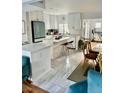 Bright kitchen boasts an island, stainless steel appliances, and white cabinetry at 738 Tam O Shanter, Las Vegas, NV 89109