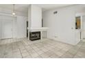 Living room featuring a fireplace and tile floors at 7701 Sea Cliff Way, Las Vegas, NV 89128