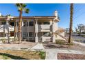 Exterior view of the condo building with desert landscaping and staircase access at , Las Vegas, NV 89128