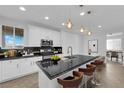 Bright kitchen featuring stainless steel appliances, and black countertops at 2033 Old Field Ave, North Las Vegas, NV 89081