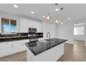 Bright kitchen featuring stainless steel appliances, and black countertops at 2033 Old Field Ave, North Las Vegas, NV 89081