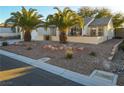 Single-story house with desert landscaping and two palm trees at 2771 Fort Myer Ave, Henderson, NV 89052