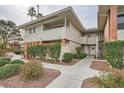 Brick condo building with landscaped grounds at 2855 Geary Pl # 3205, Las Vegas, NV 89109