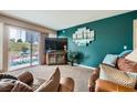 Spacious living area with teal walls and patio access at 2855 Geary Pl # 3205, Las Vegas, NV 89109