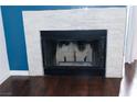 Modern fireplace with a clean, light stone surround at 3150 Soft Breezes Dr # 2025, Las Vegas, NV 89128