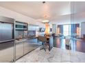 Modern kitchen with stainless steel appliances and marble flooring at 4381 W Flamingo Rd # 8304, Las Vegas, NV 89103