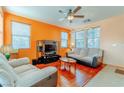 Spacious living room featuring hardwood floors and ample natural light at 5373 Sleeping Cat St, Las Vegas, NV 89122