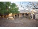 Spacious backyard with patio cover, grill, and playset at 572 Decidedly St, Henderson, NV 89015