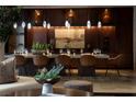 The elegant dining room features designer lighting, a long table, and stylish seating for sophisticated meals at 641 Saint Croix St, Henderson, NV 89012
