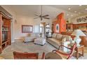 Open living room with comfortable seating, built-in shelving, and an accent wall at 741 Antelope Ave, Pahrump, NV 89060