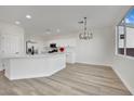 Modern kitchen with white cabinets, stainless steel appliances, and an island at 9316 Perennial Ave, Las Vegas, NV 89148