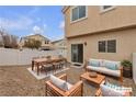 Backyard patio showcasing outdoor furniture including a dining table and cushioned seating area at 9323 Leaping Deer Pl # 102, Las Vegas, NV 89178